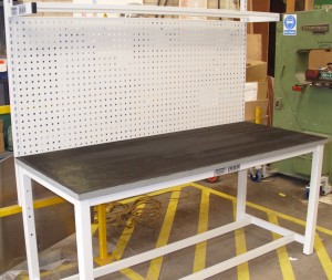 Assembly Bench with Perforated Storage Panel