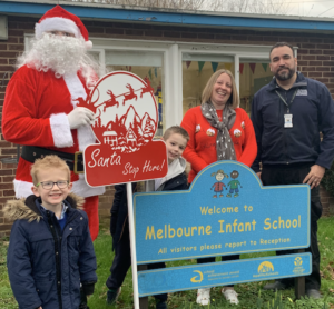 Santa Delivers Sign Donated by Acres to School