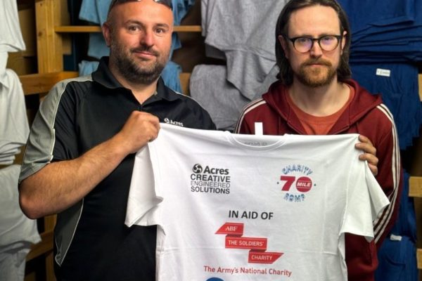 Shaun picks up his 70-Mile Charity Walk T-Shirts